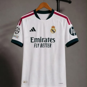 Front view of a white Real Madrid jersey with burgundy shoulder stripes, dark collar and cuffs on a hanger